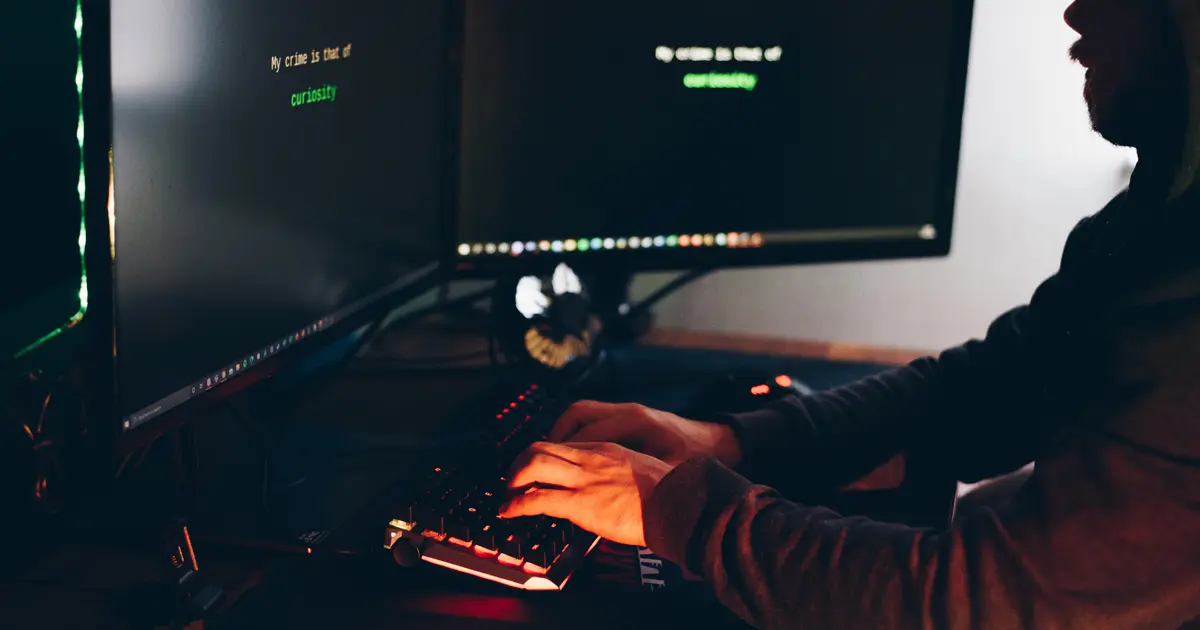 A guy working on his computers.