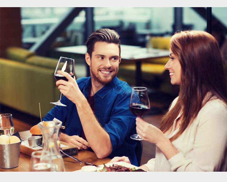 A couple having a wine.